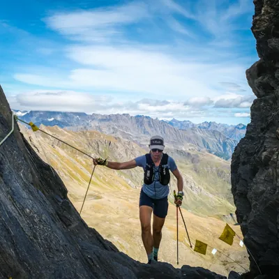 Trail runner on a rocky mountain ridge