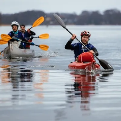 Kayakers and a canoe on a lake