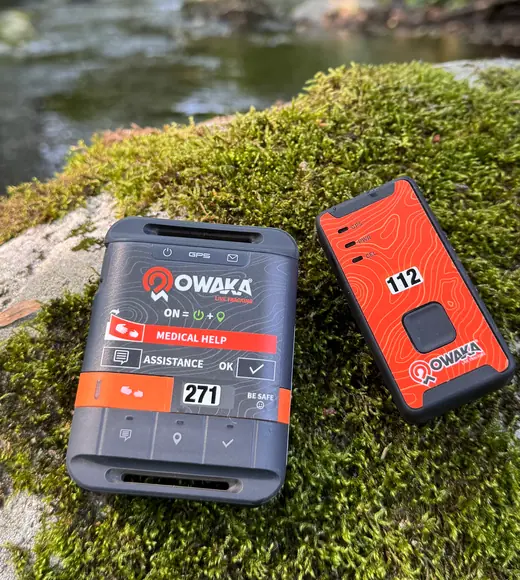 Owaka GPRS and satellite trackers lying on moss by a river