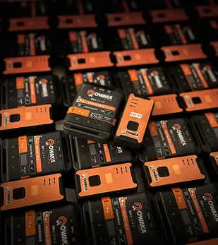 Owaka satellite and GPRS GPS trackers lying on a fleet of trackers